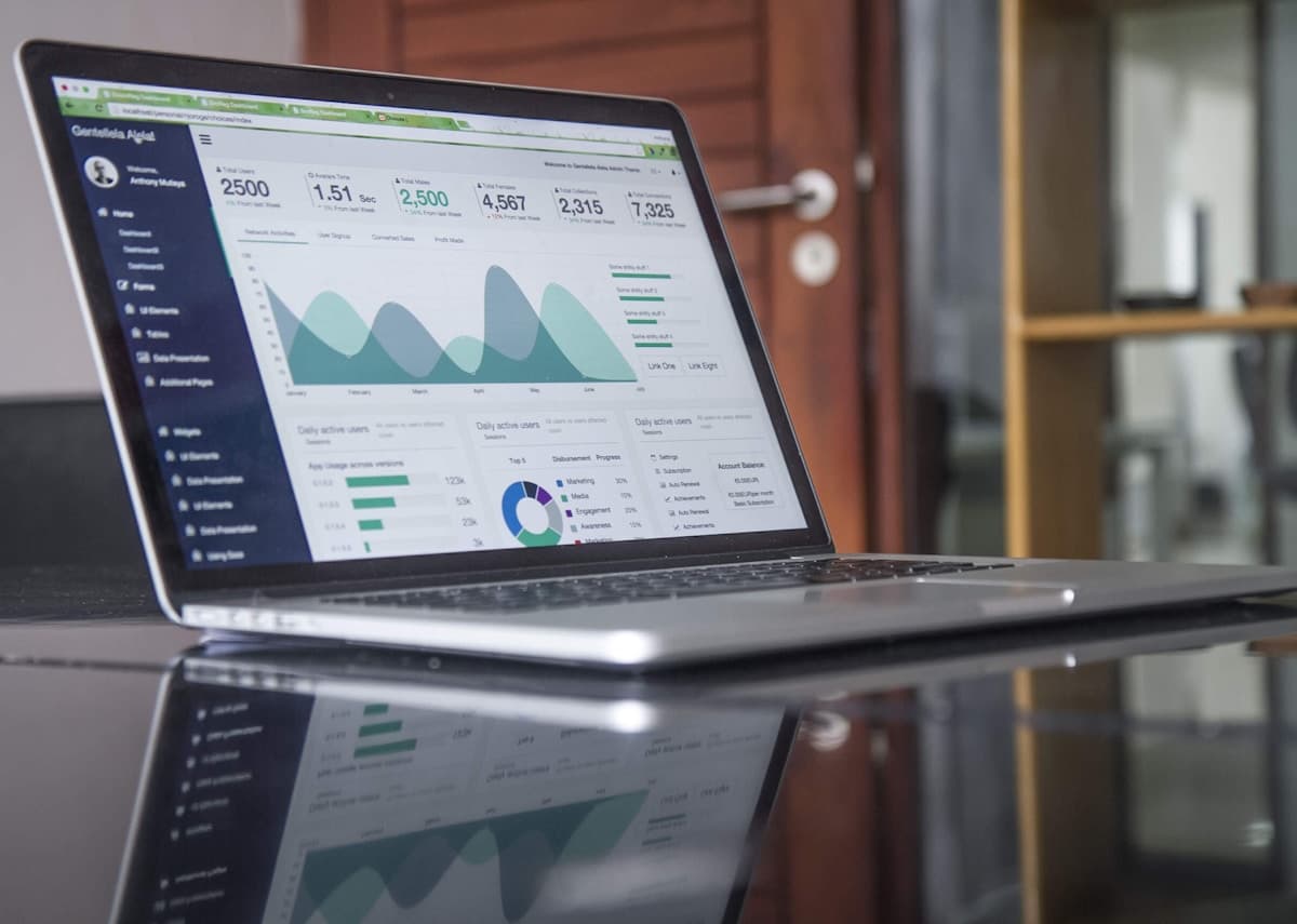 Marketing performance data on laptop screens